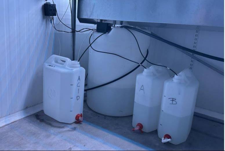 Stock solution tanks A, B and acid connected to the NEX-F dosing system